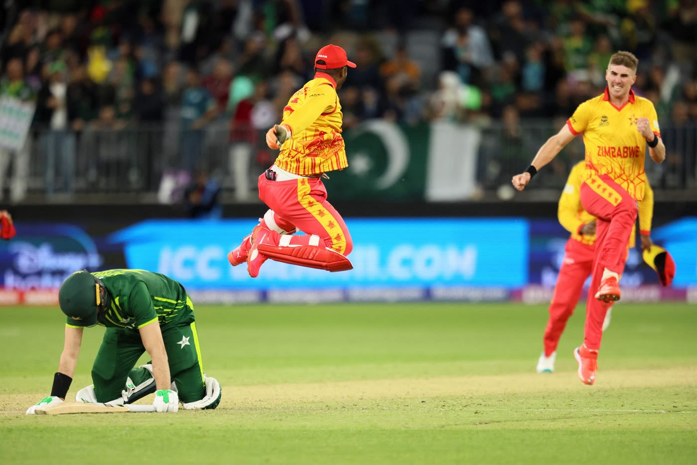 Contrasting emotions: Brad Evans and Regis Chakabva jump for joy while Shaheen Afridi sinks to the ground after being run-out last ball