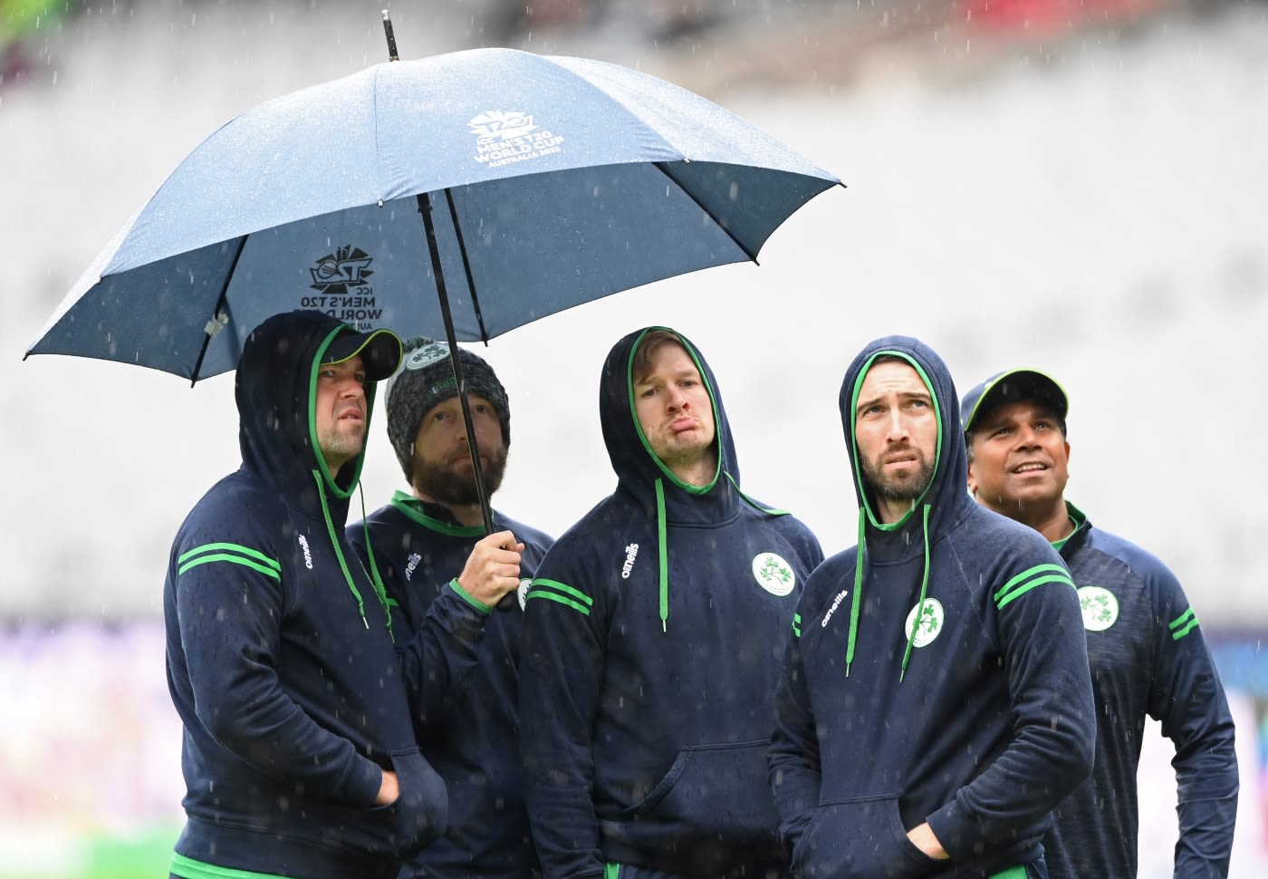 Ireland's players take shelter from the rain
