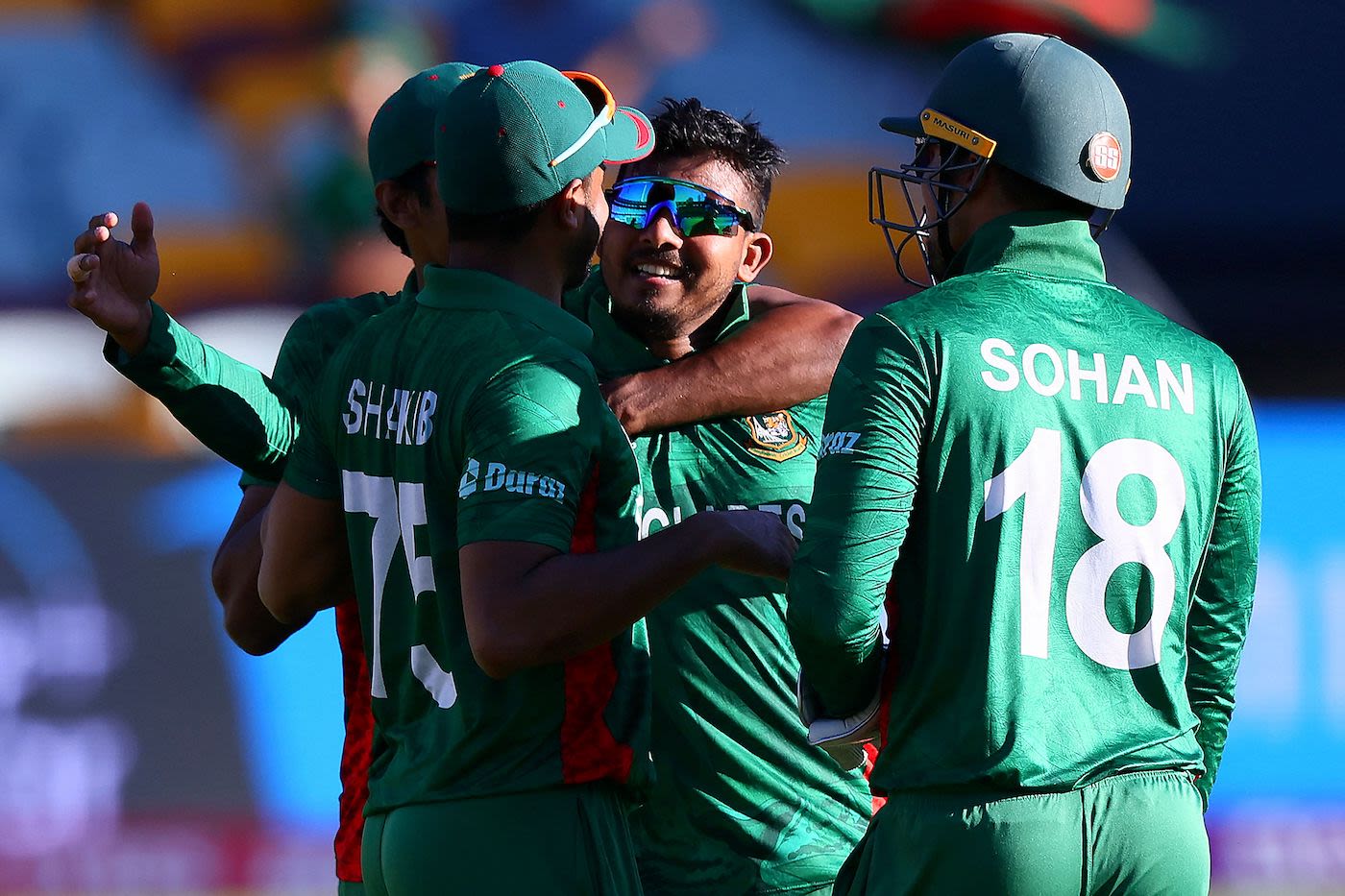 Mosaddek Hossain is mobbed after finishing the job