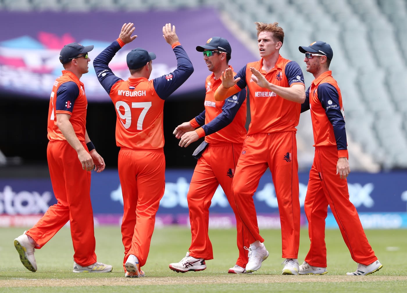Fred Klaasen celebrates with team-mates the wicket of Quinton de Kock
