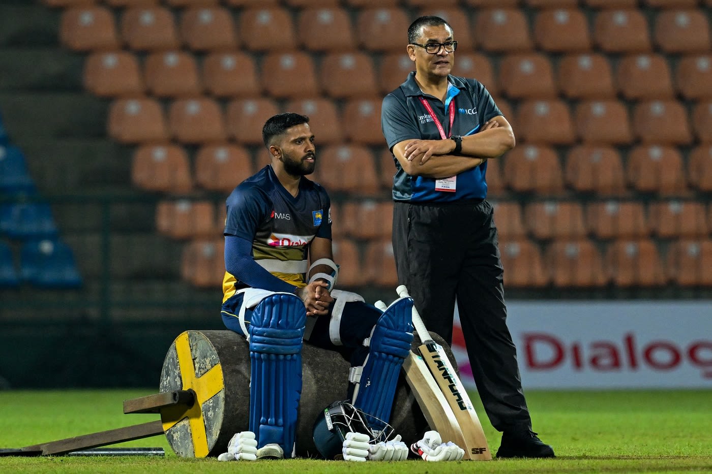 Kusal Mendis and ICC match referee Ranjan Madugalle observe a practice session