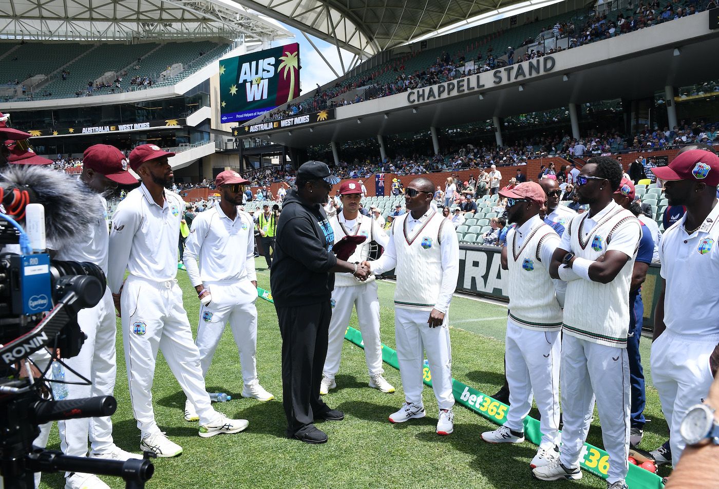 Devon Thomas receives his Test cap from Carl Hooper