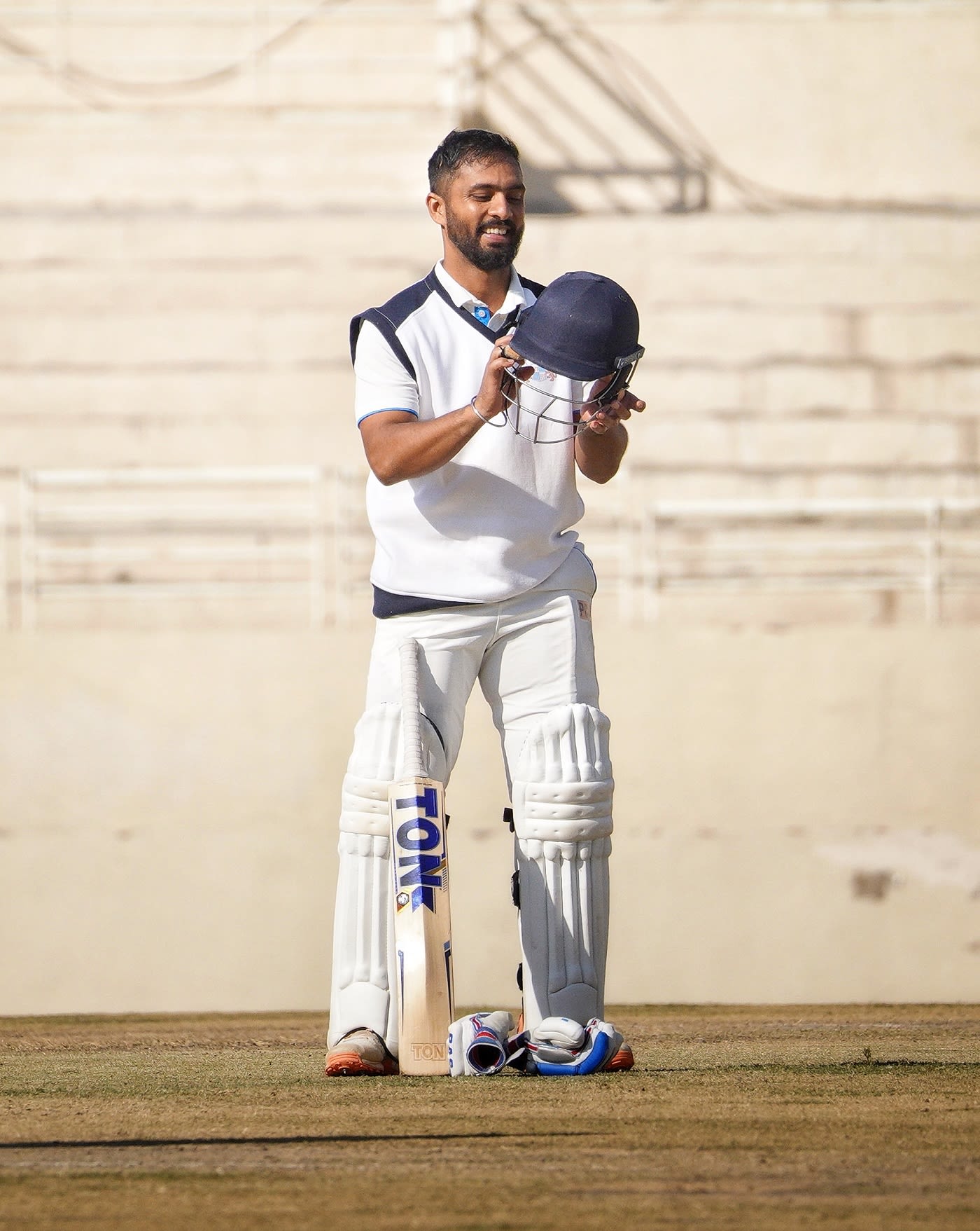 Mandeep Singh adjusts his helmet