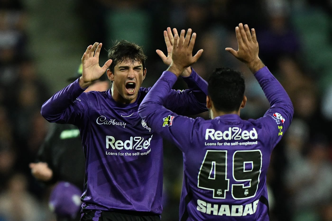 Patrick Dooley celebrates with Shadab Khan the wicket of Faf Du Plessis