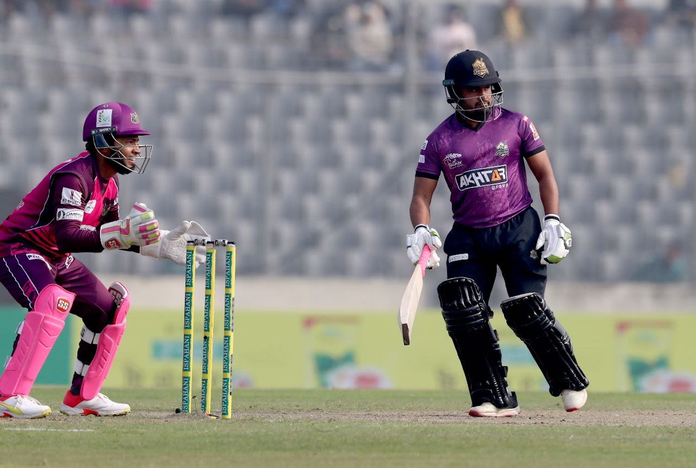 Al-Amin takes a run as Mushfiqur Rahim sets up to receive a throw