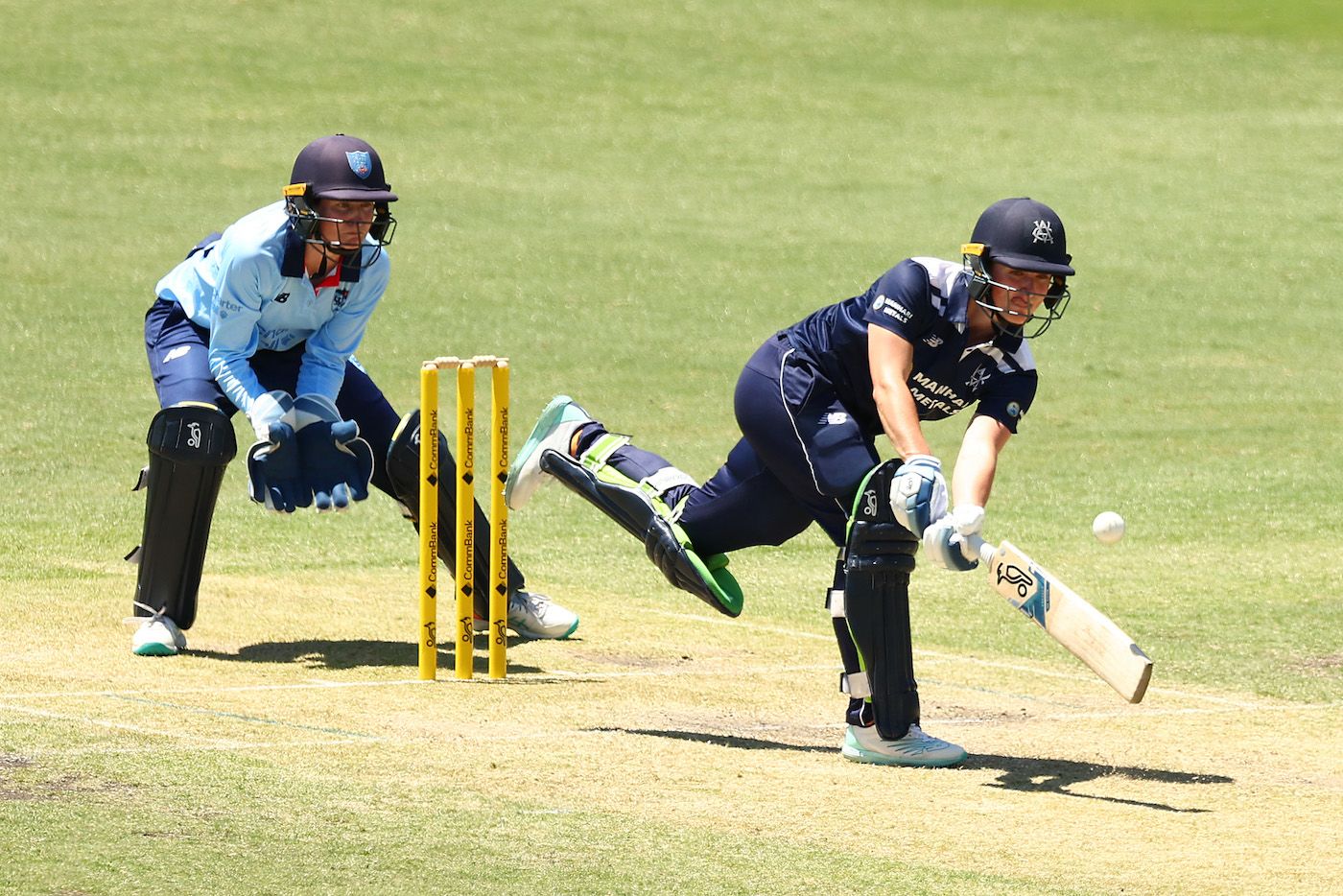 Sophie Reid gets into an unusual position to get to the ball