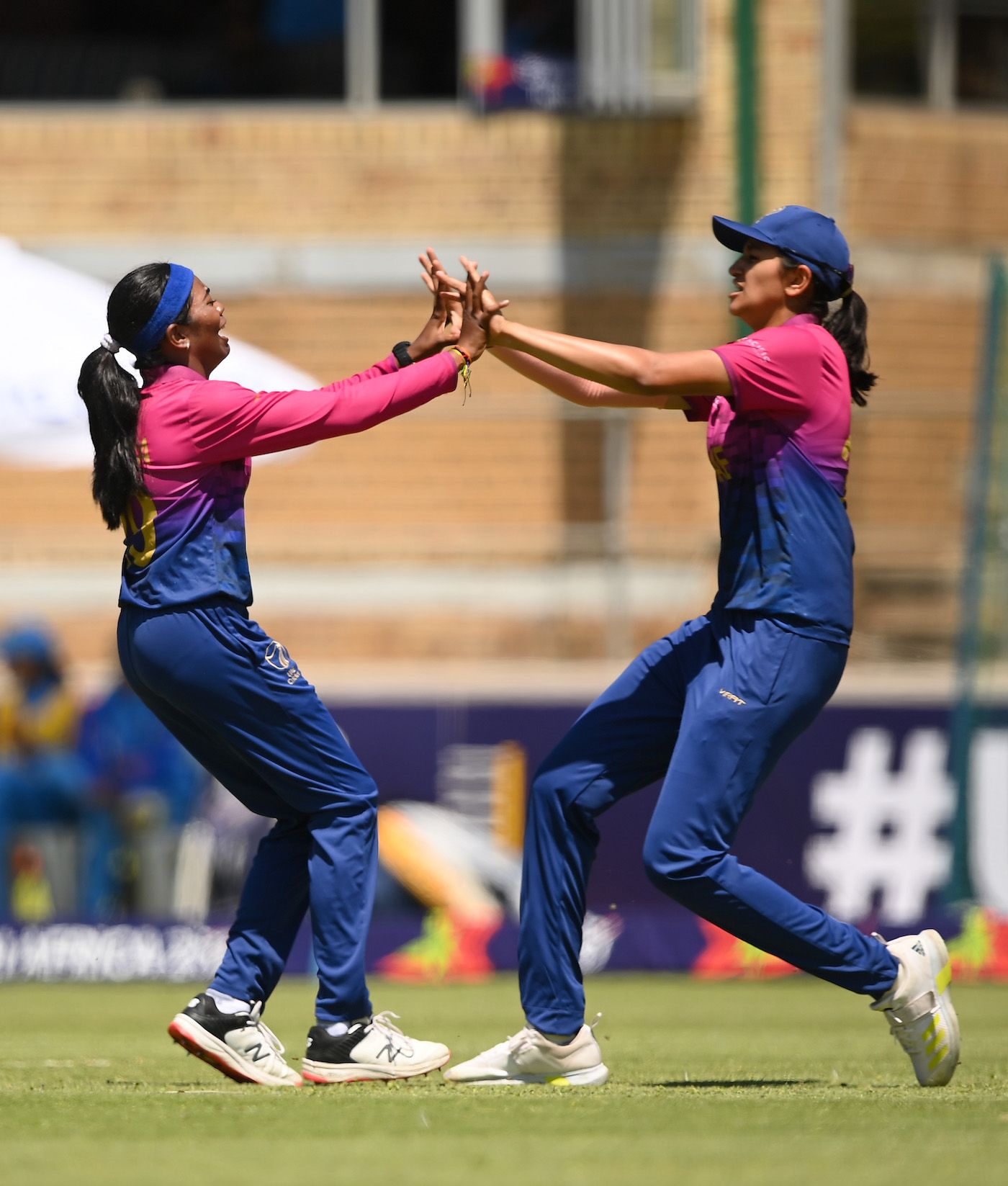 Indhuja Nandakumar and Mahika Gaur celebrate after combining to dismiss Shafali Verma