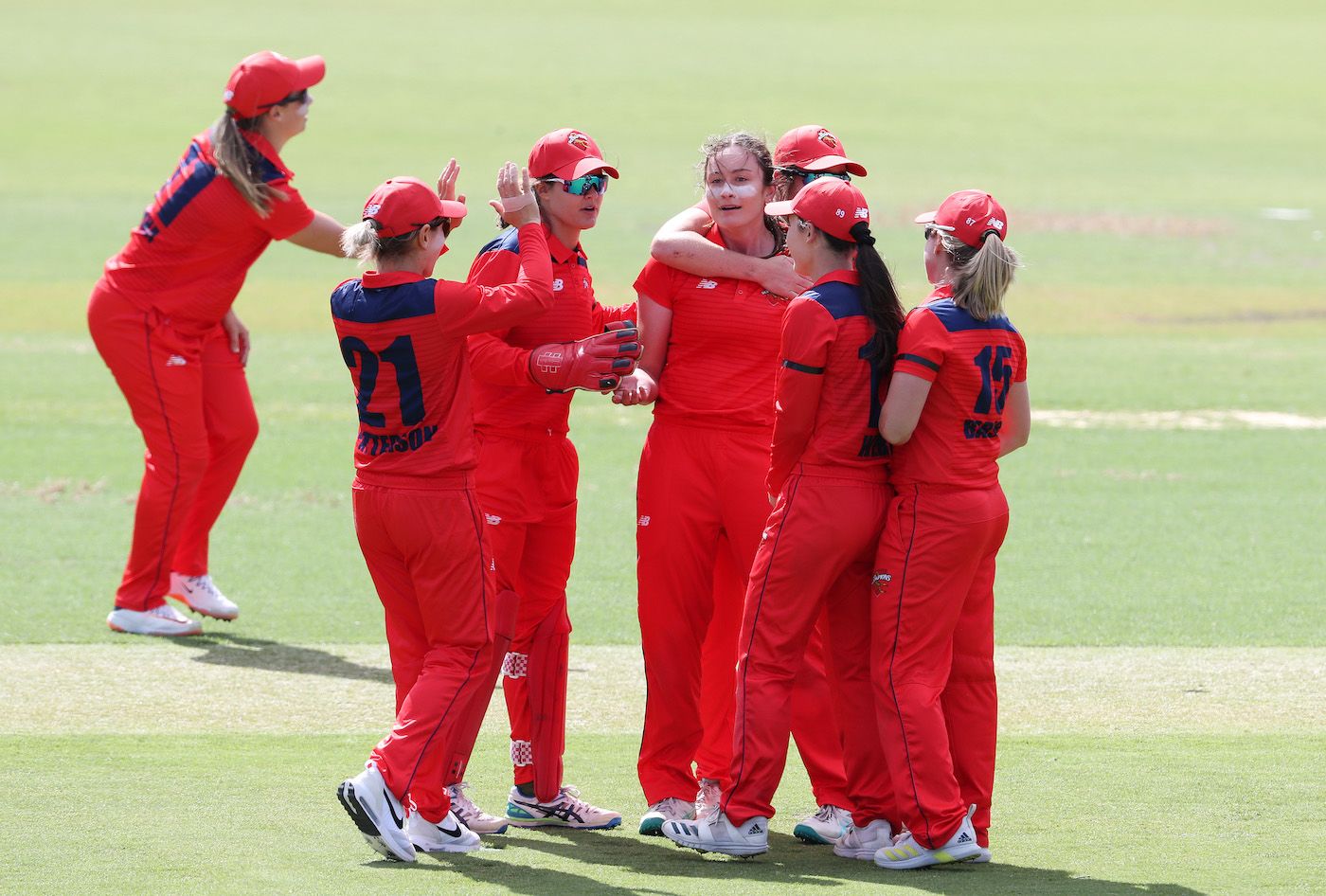 Kate Peterson is mobbed after striking for South Australia
