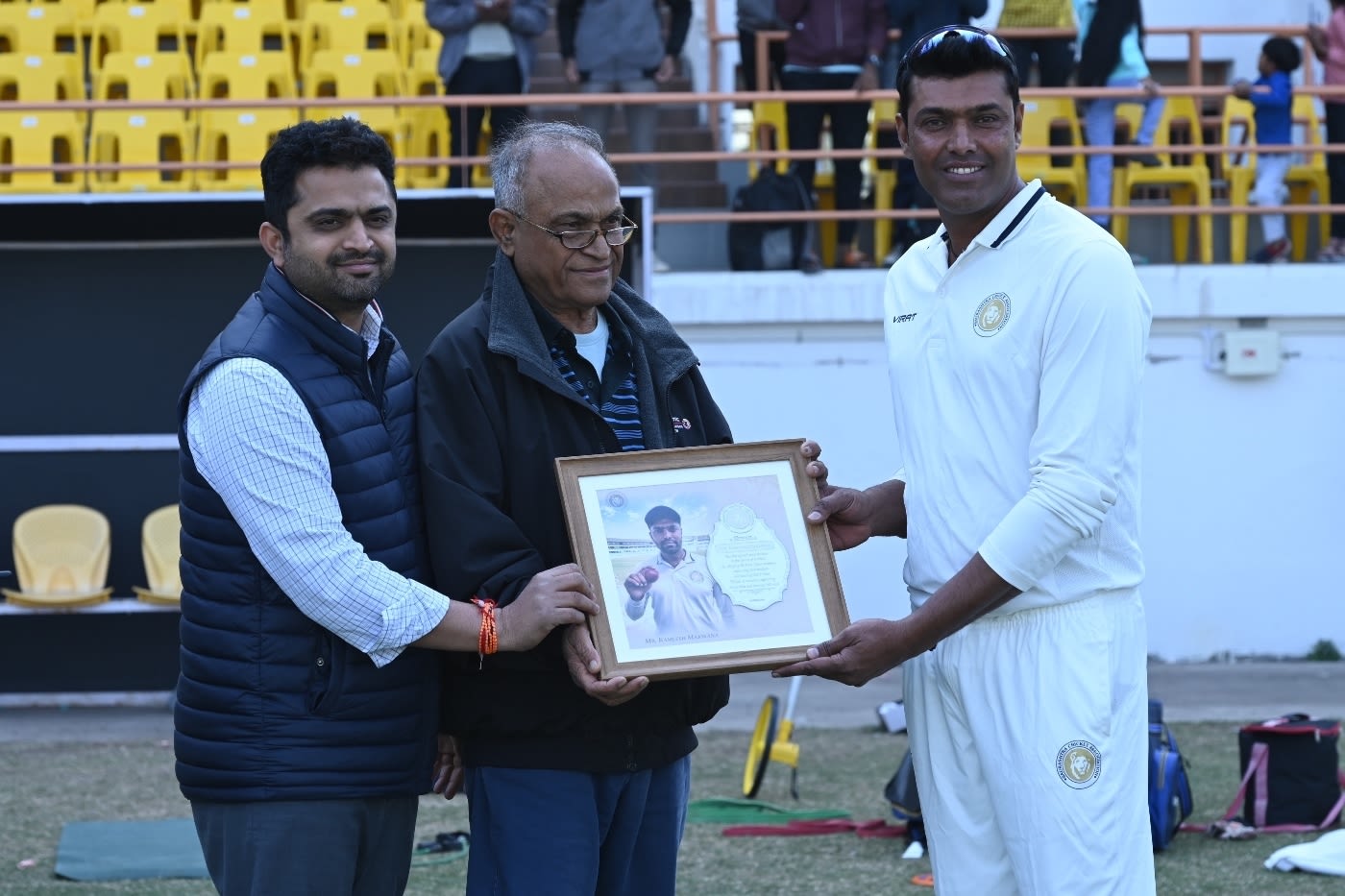 Kamlesh Makwana collects a memento after retiring from all formats