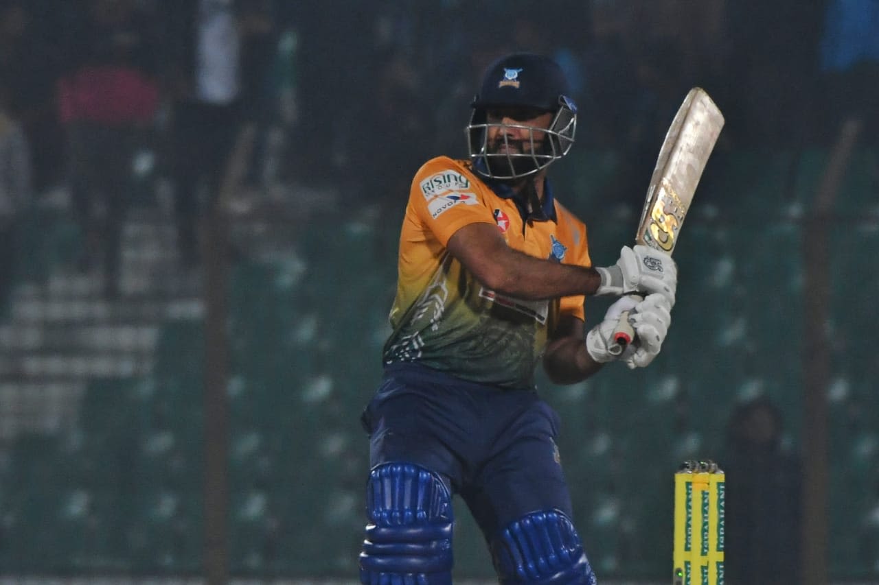Usman Ghani powers the ball away during his quick 30