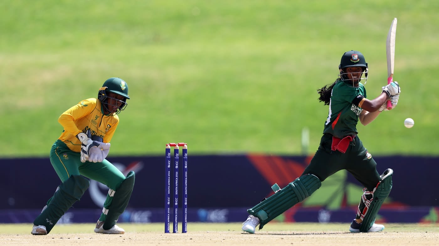 Shorna Akter of Bangladesh plays a shot as Karabo Meso of South Africa looks on