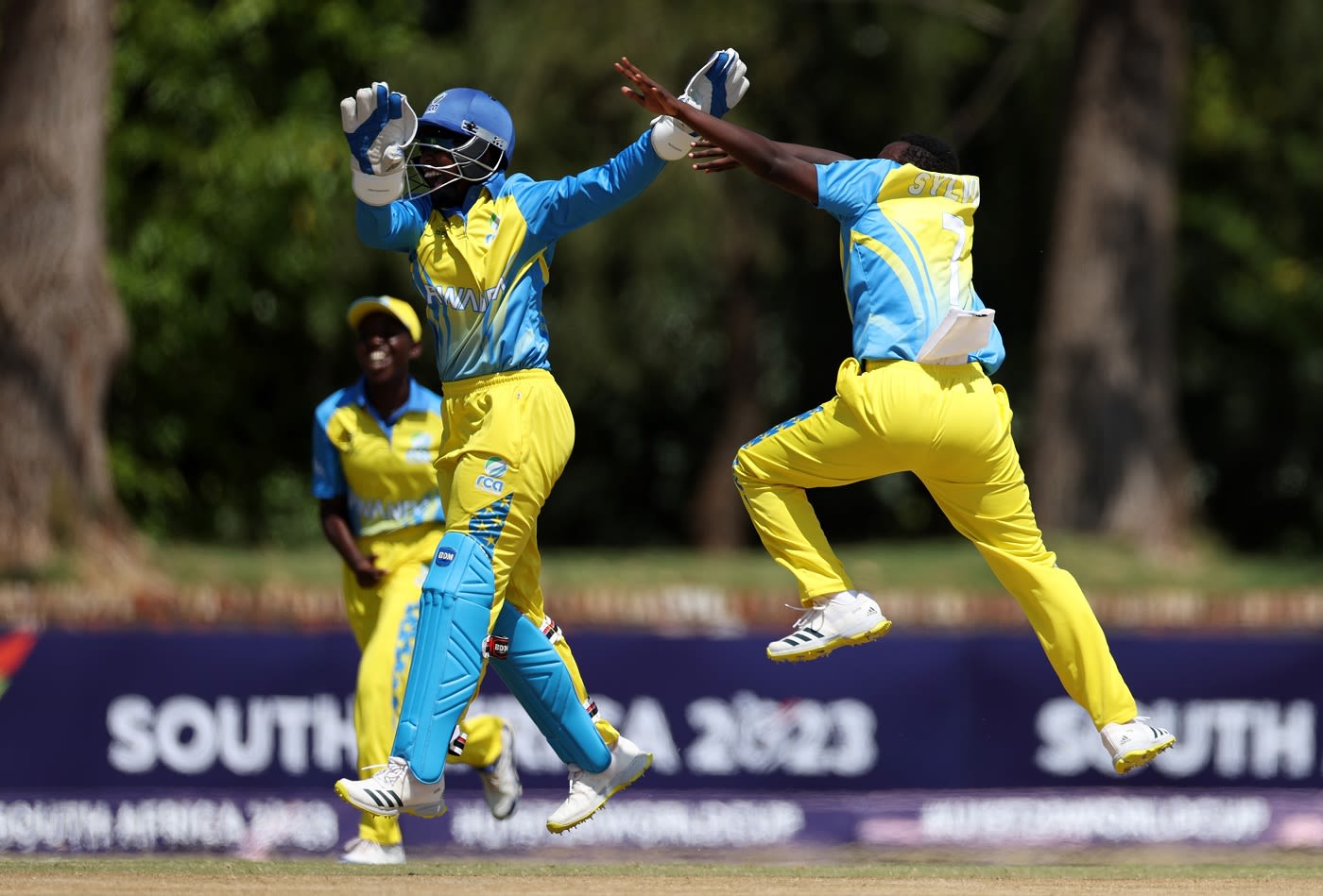Wicketkeeper Merveille Uwase and Sylvia Usabyimana celebrate a dismissal