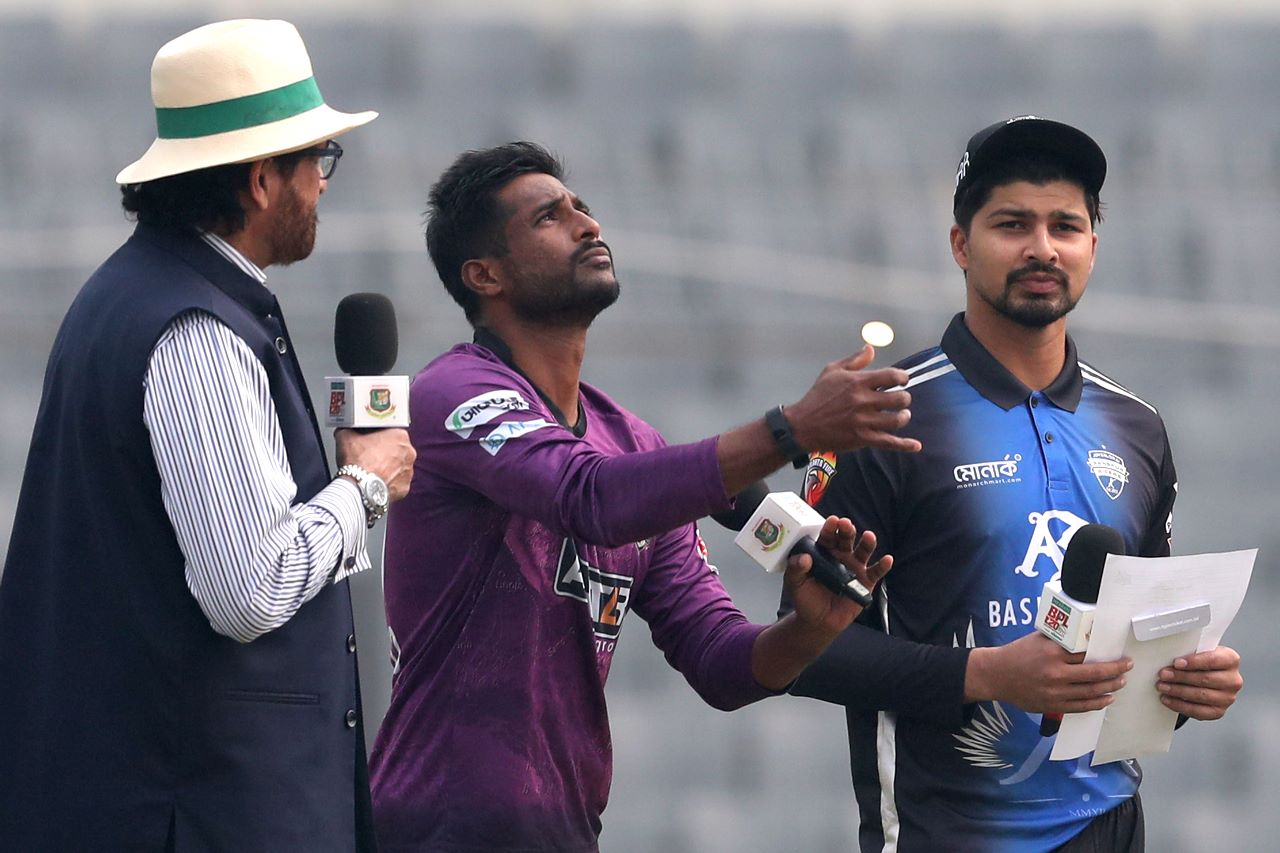 Shuvagata Hom flips the coin - the returning Nurul Hasan called wrong and was asked to bat