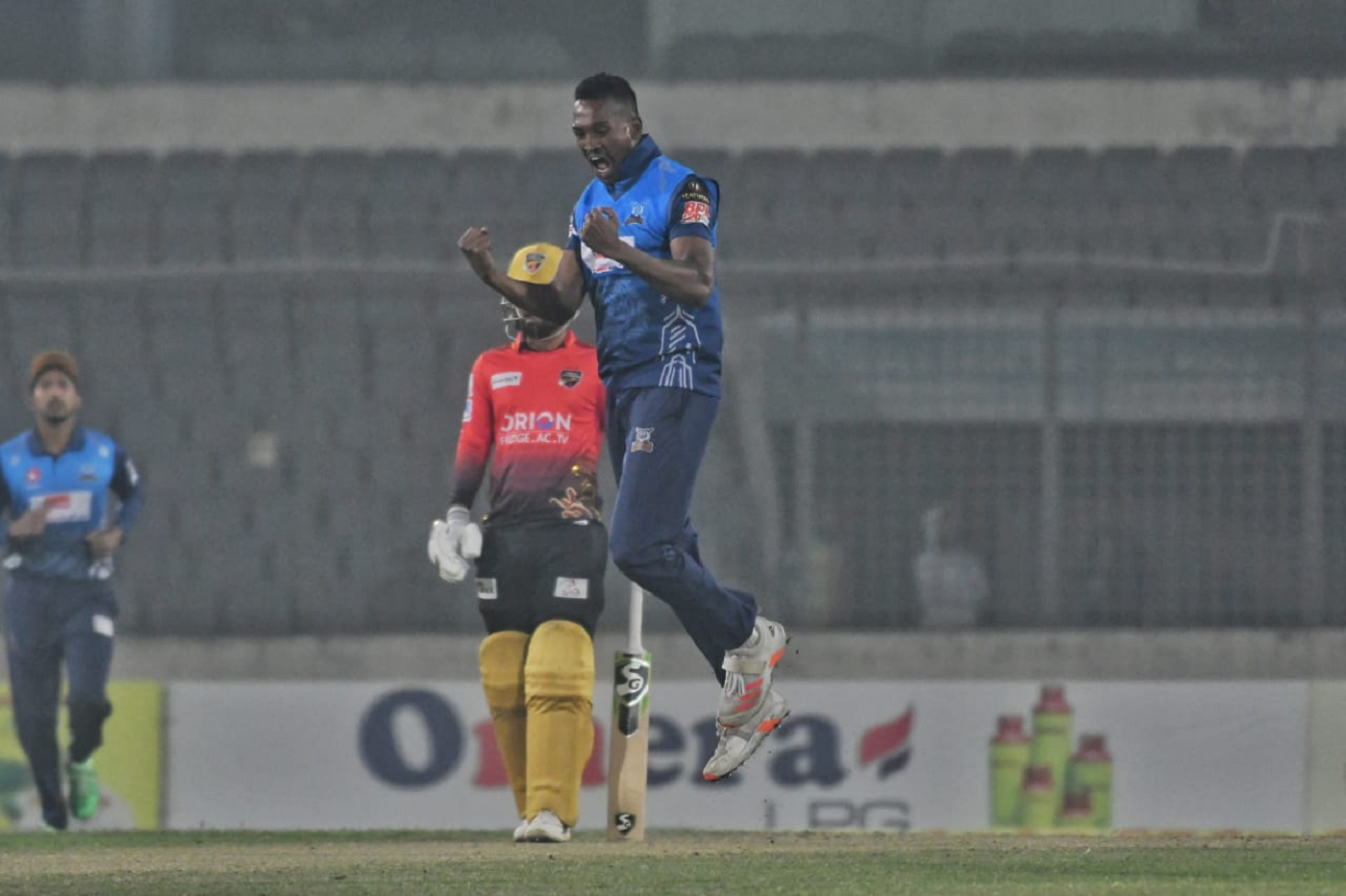 Al-Amin Hossein celebrates after castling Mohammad Rizwan early