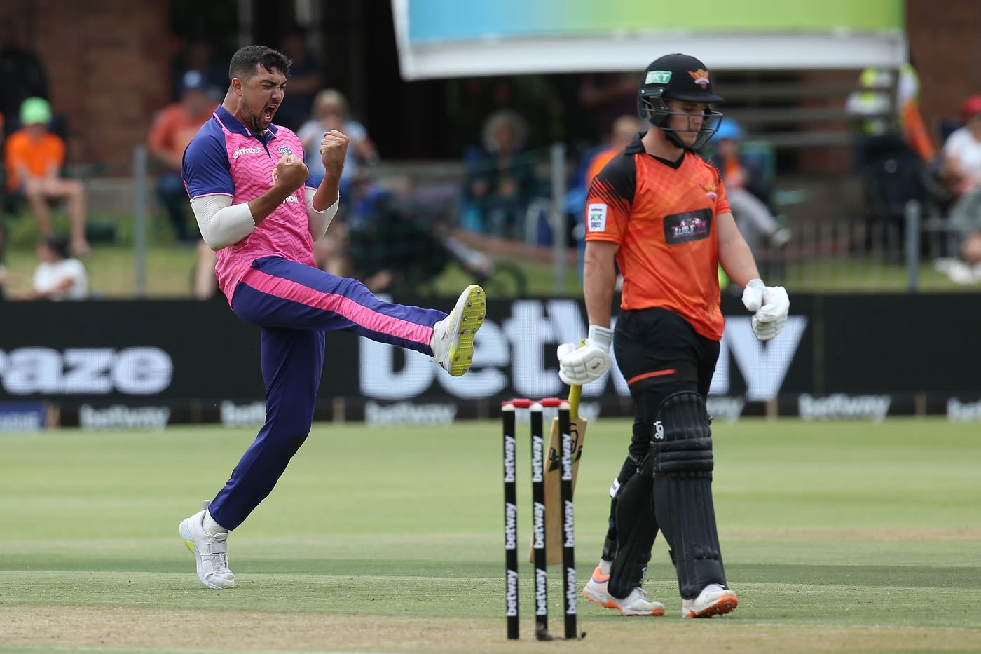 Evan Jones celebrates a wicket