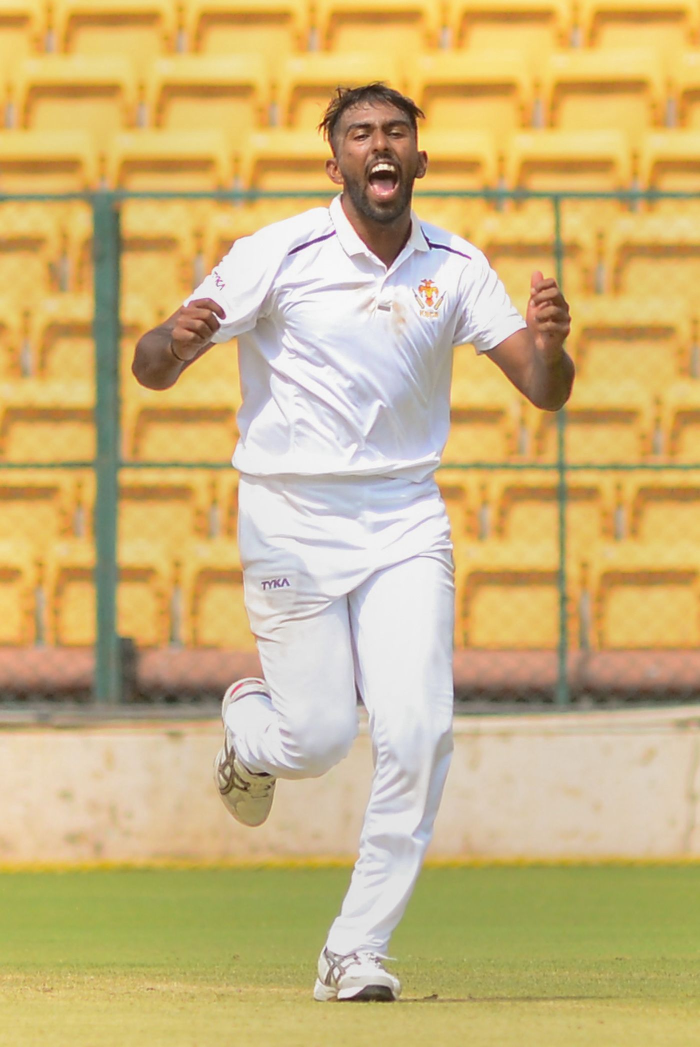 M Venkatesh celebrates after picking up a wicket