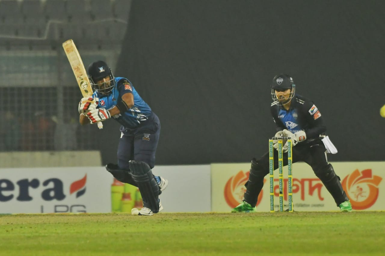Ariful Haque tries to work the ball away