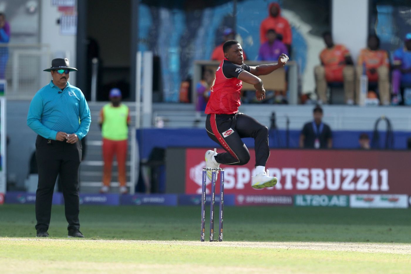 Sheldon Cottrell levitates as he comes in to bowl