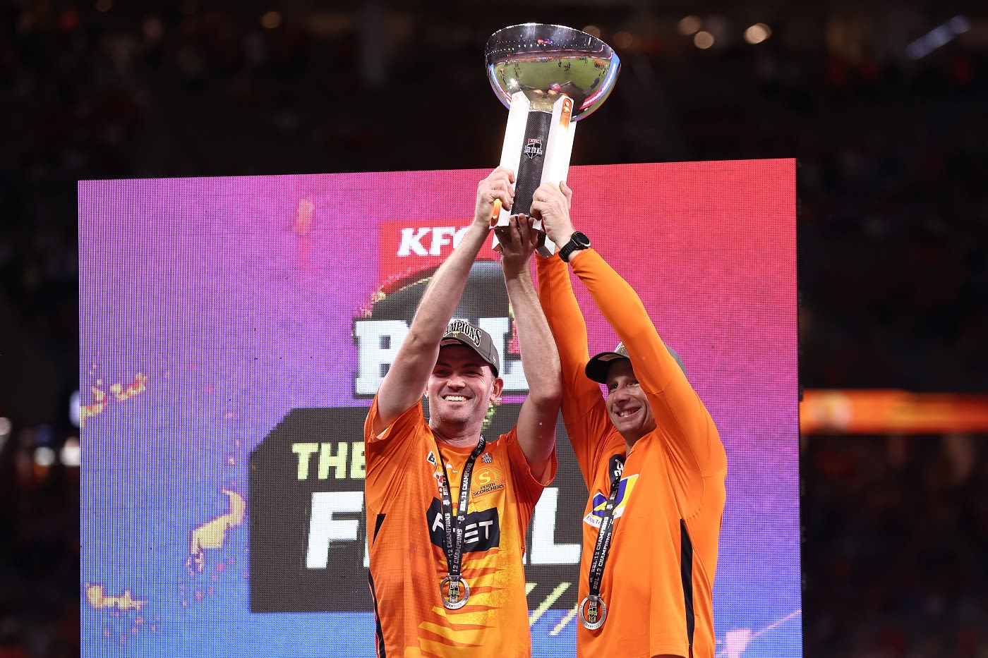 Ashton Turner and Adam Voges hold the trophy aloft