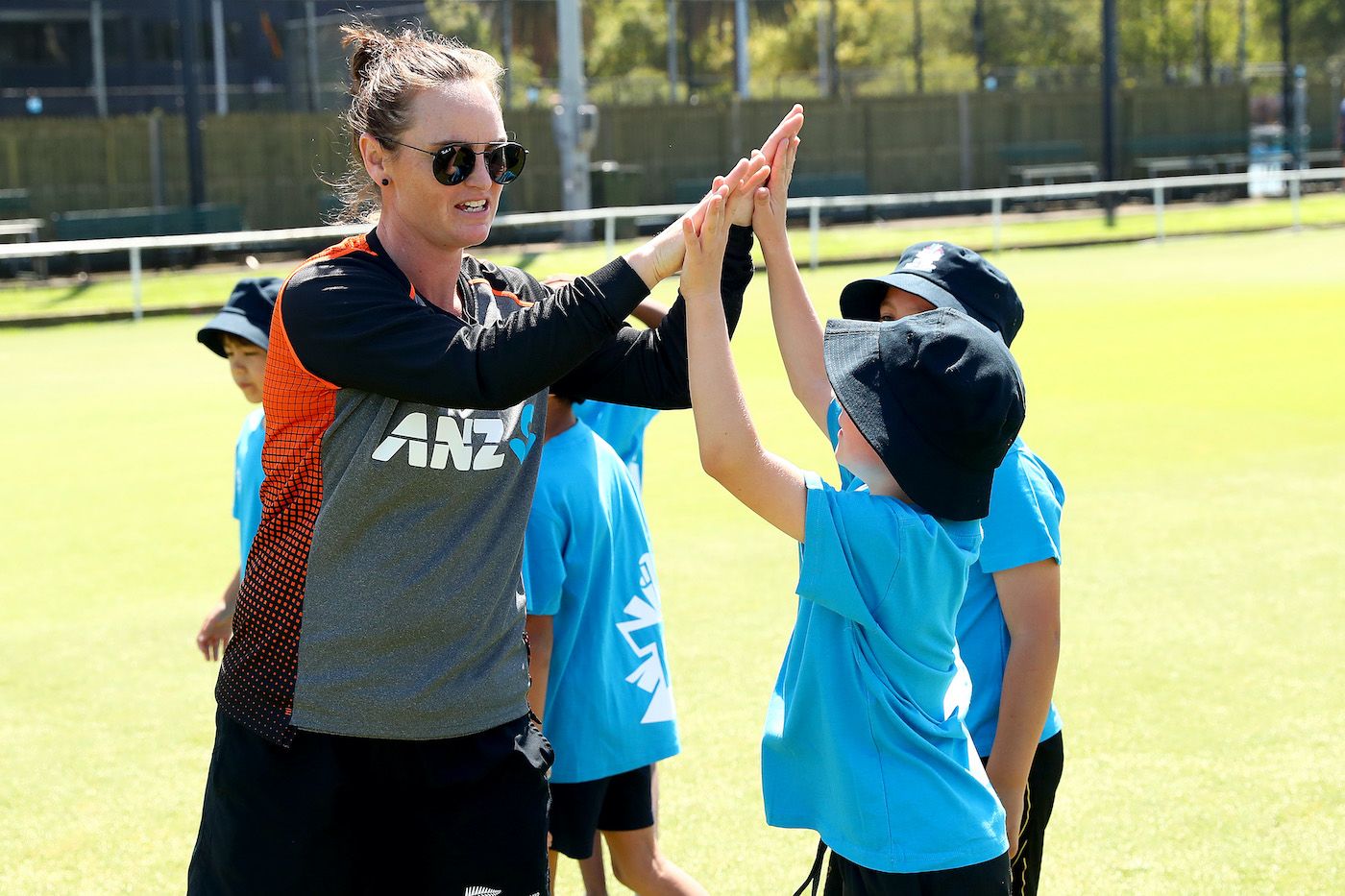 Hayley Jensen high-fives a kid