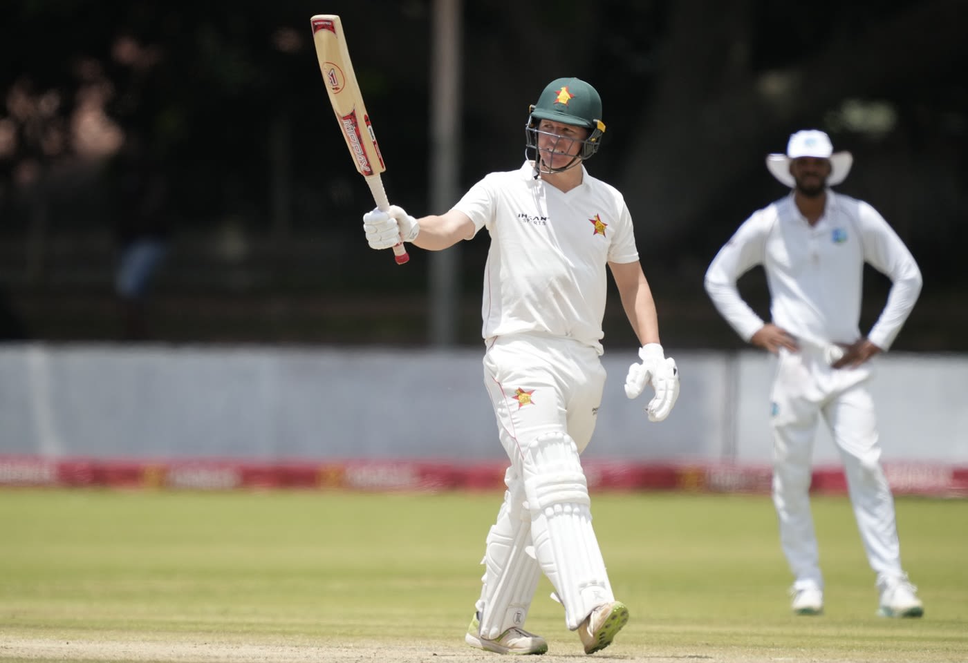 Gary Ballance celebrates his half-century