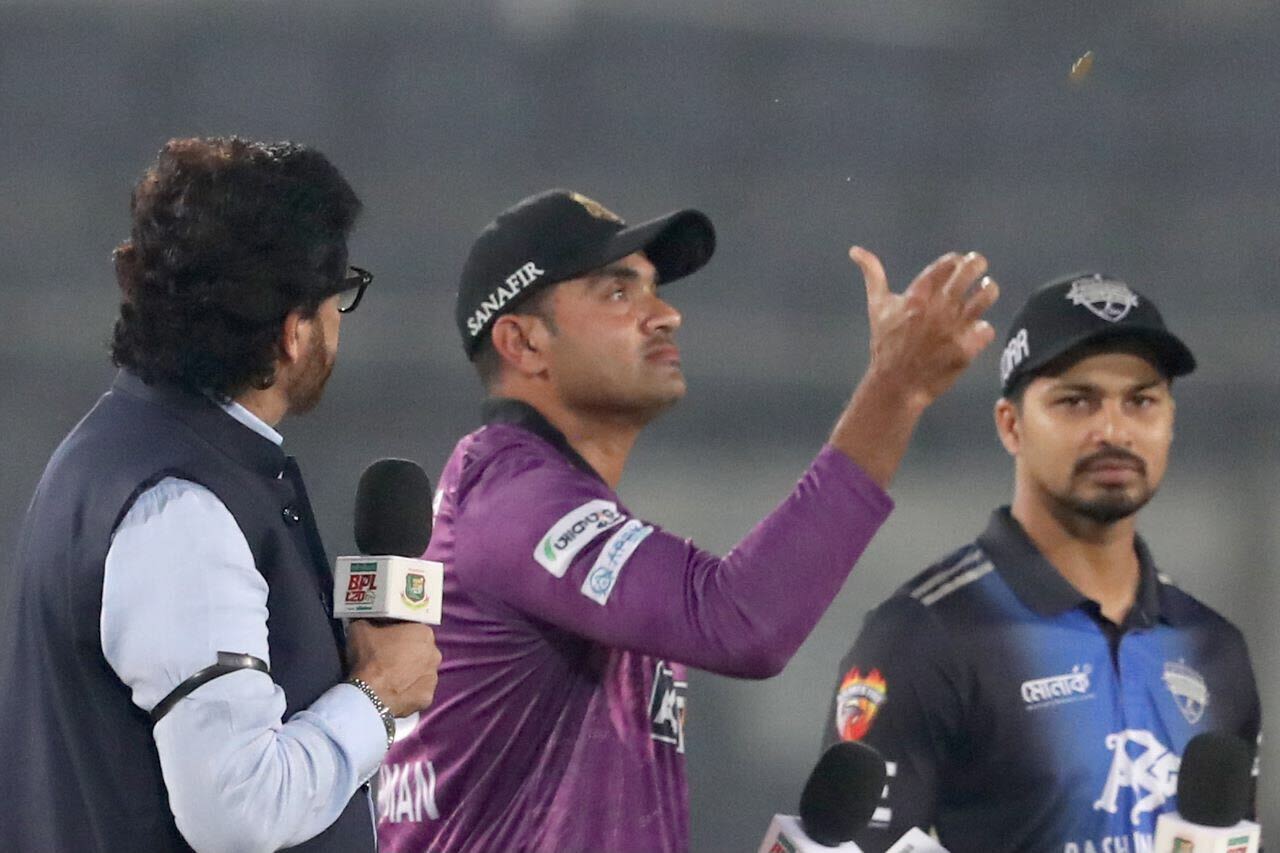 Ziaur Rahman flips the coin
