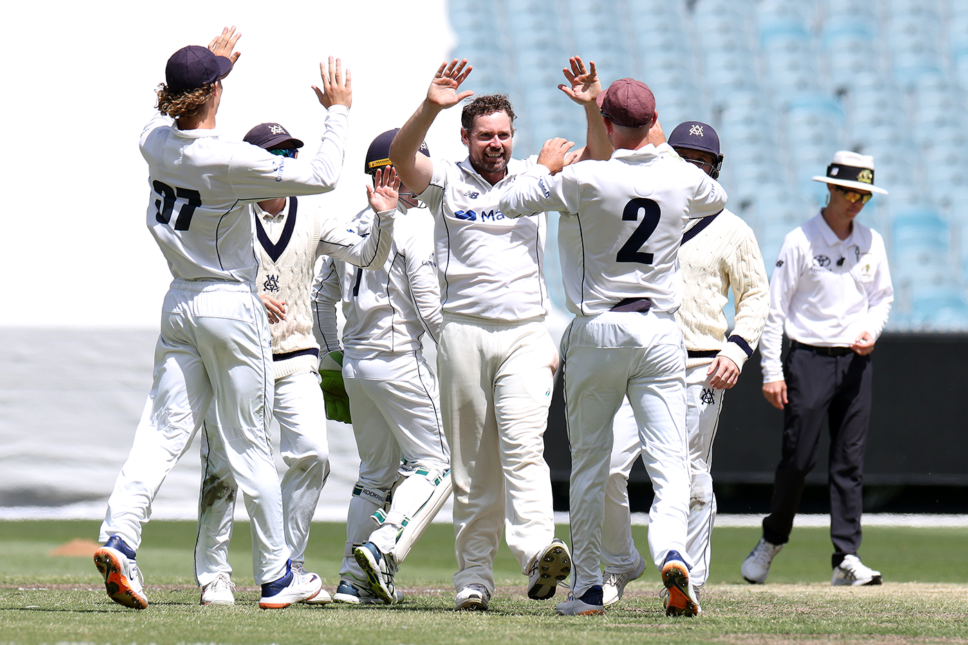 Victoria celebrate one of Jon Holland's final-day wickets