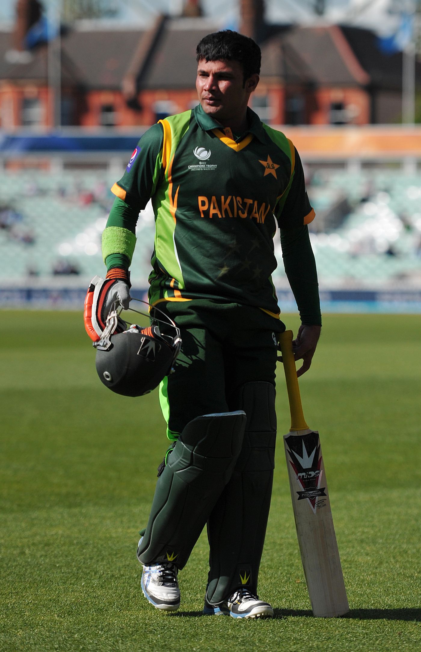 Imran Farhat walks back after being dismissed