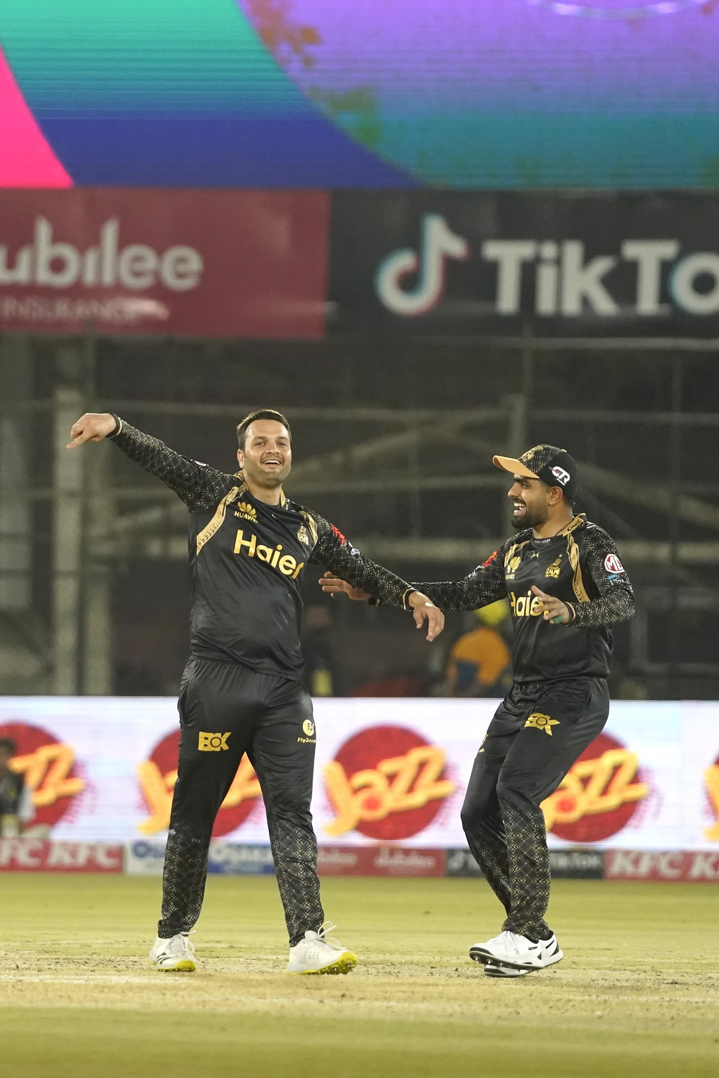 Usman Qadir celebrates after picking his second wicket of the night