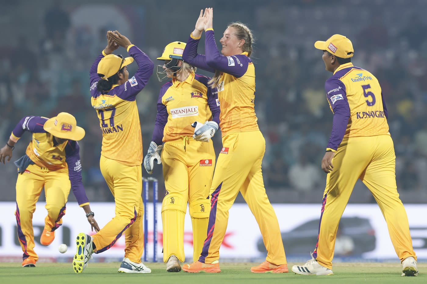 Sophie Ecclestone and Simran Shaikh celebrate a wicket