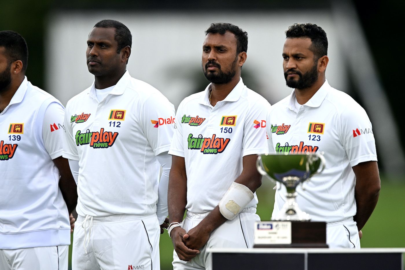 Angelo Mathews, Oshada Fernando and Dimuth Karunaratne at the national anthem