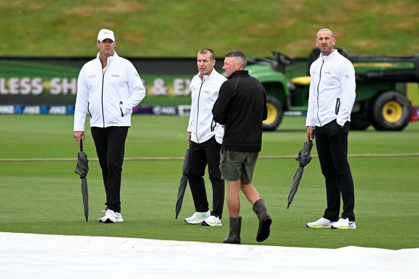 Chris Brown, Chris Gaffaney and Michael Gough inspect the field