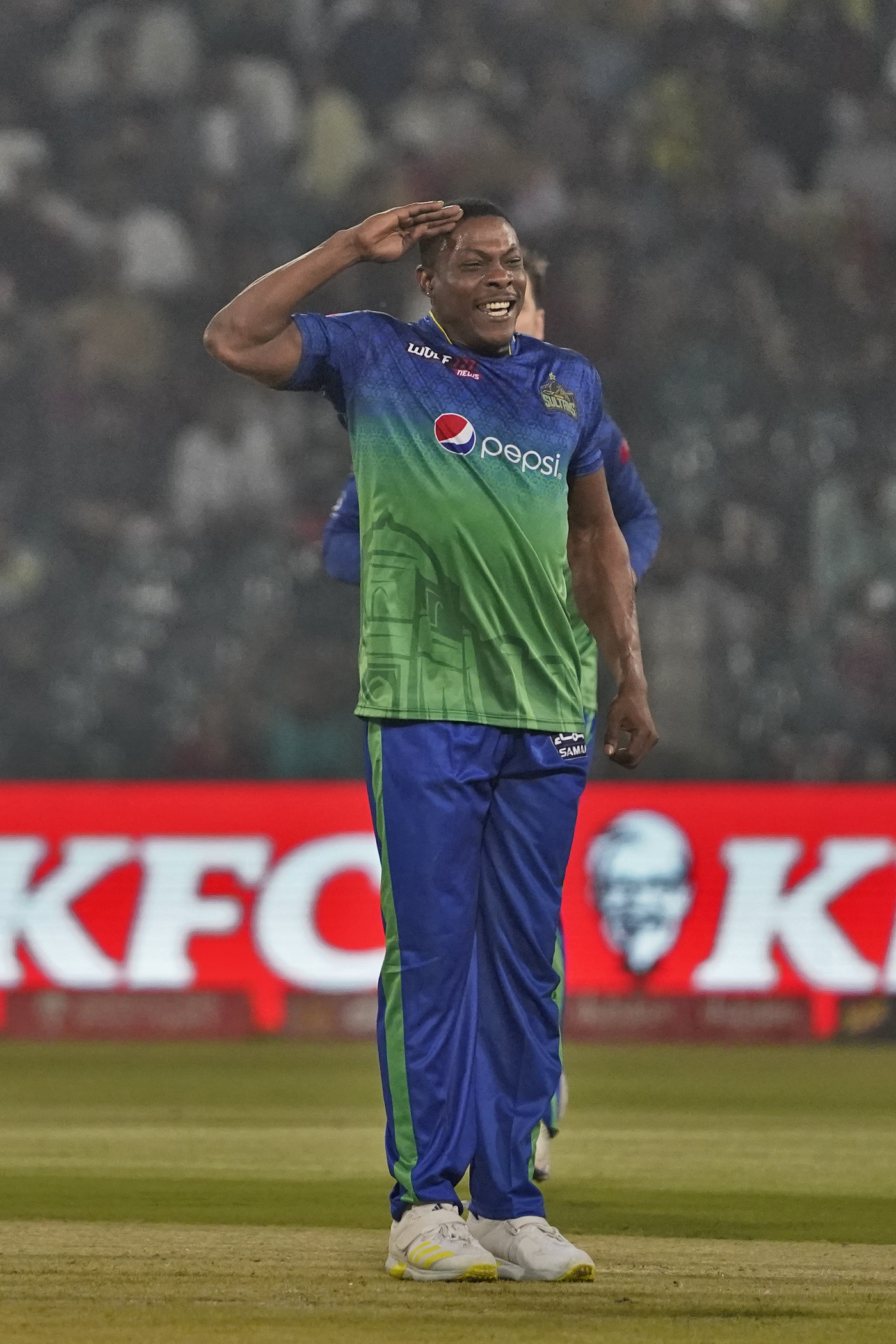 Sheldon Cottrell celebrates with his signature salute after a top order wicket