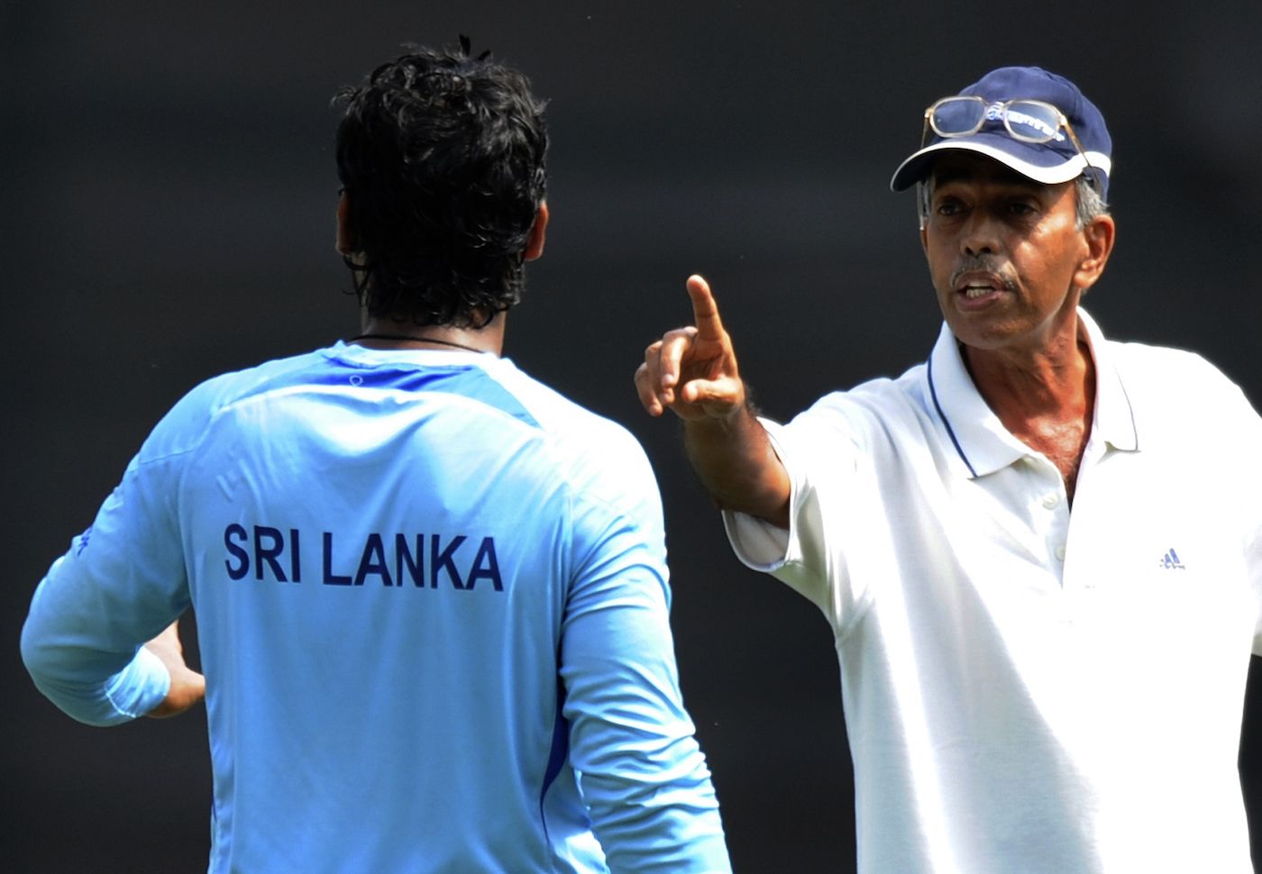 Sudhir Naik makes a point to Kumar Sangakkara