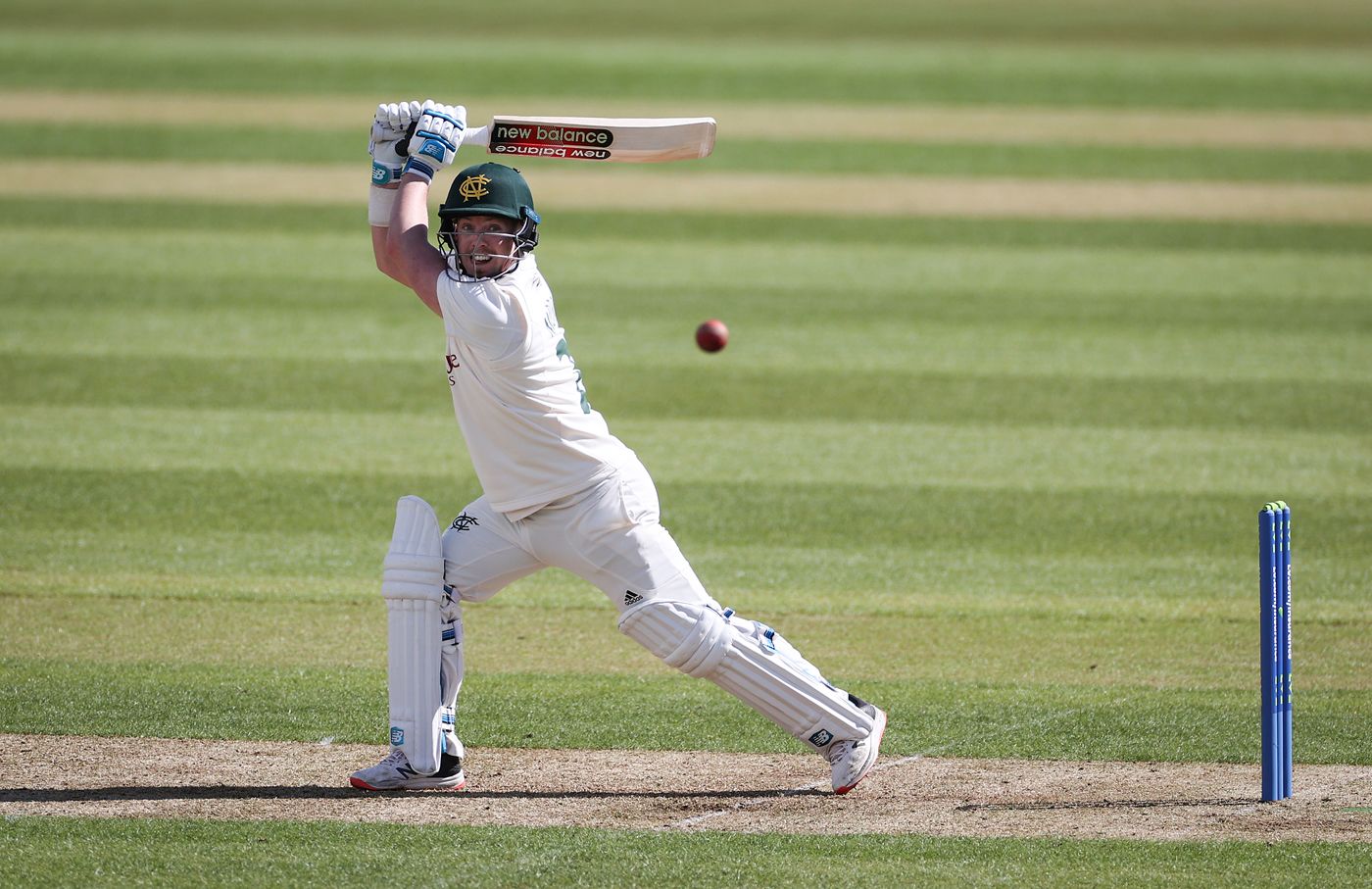 Tom Moores lashes a ball through the off side
