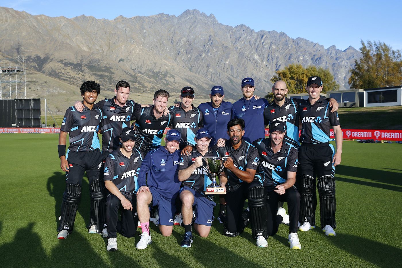 New Zealand's players pose with the trophy after completing a 2-1 series win