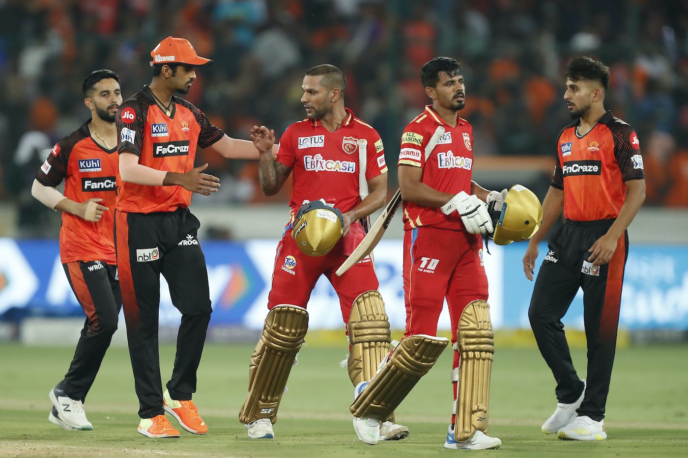Washington Sundar congratulates Shikhar Dhawan as they leave the field