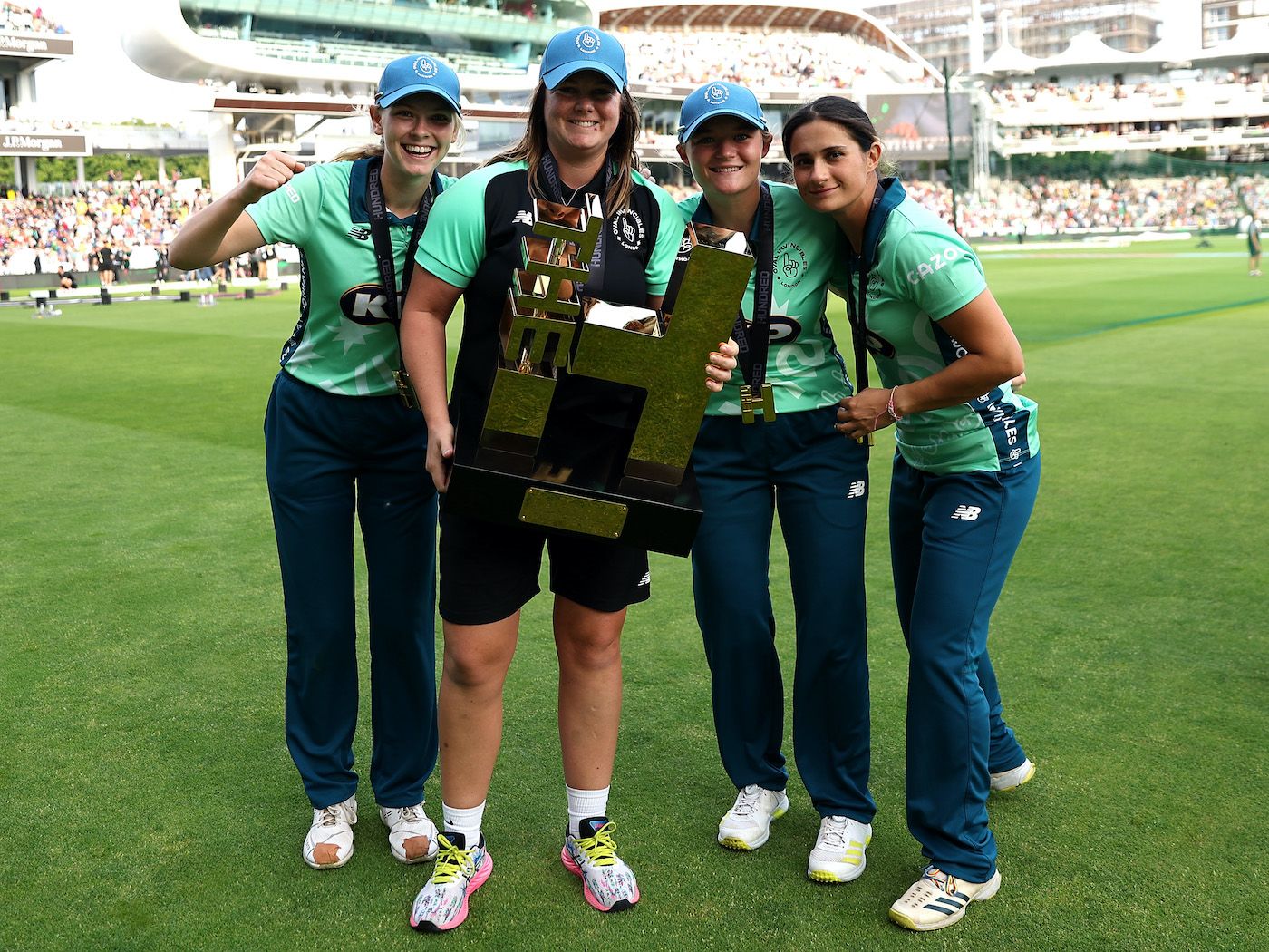 Oval Invincibles celebrate with the Hundred trophy