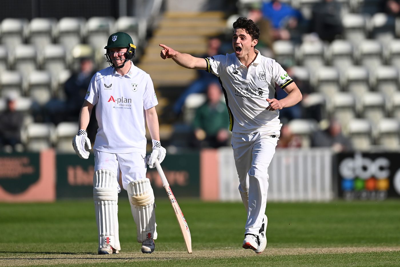 Tom Price celebrates dismissing Brett D'Oliveira to complete his hat-trick