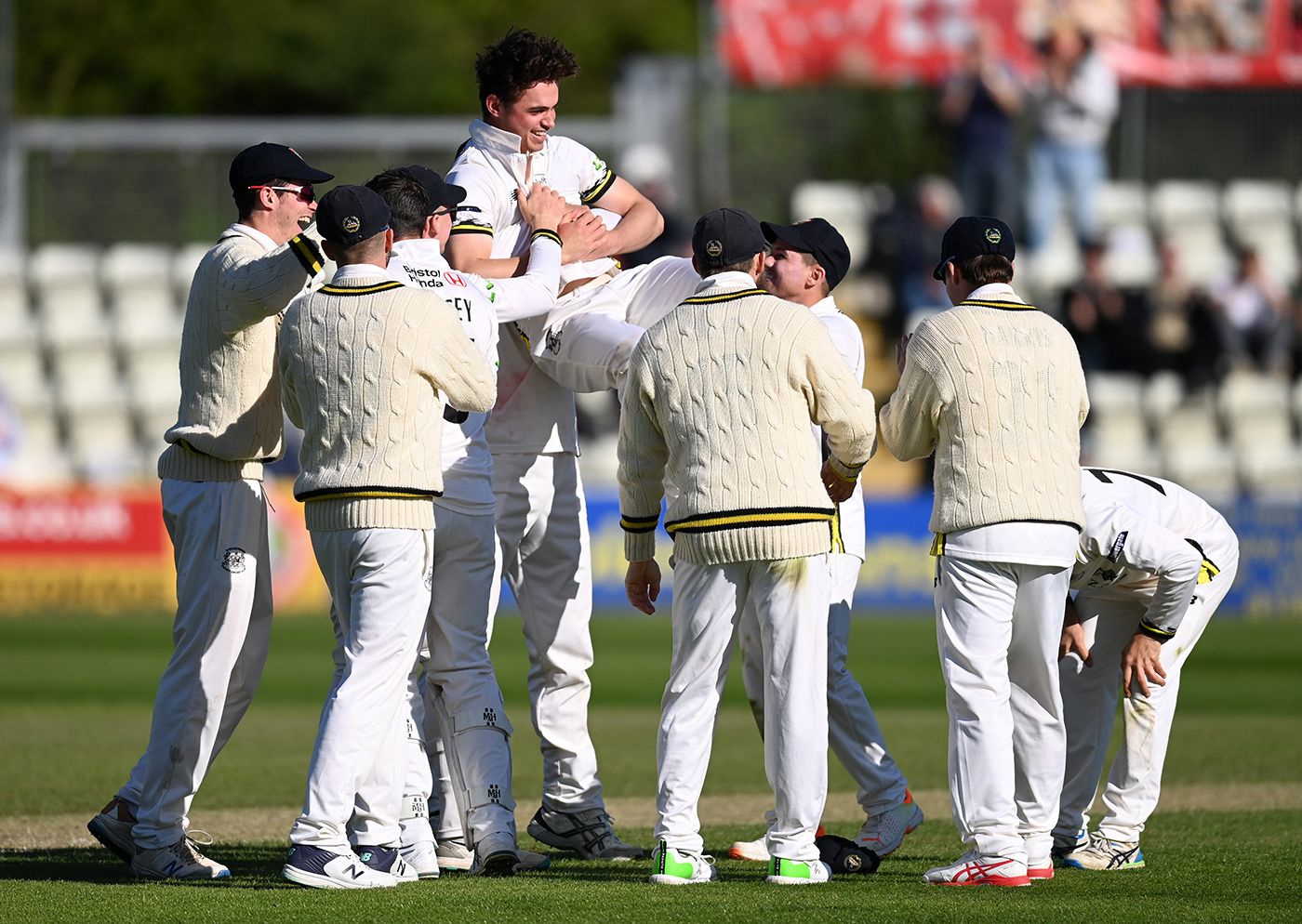 Tom Price celebrates his hat-trick with teammates