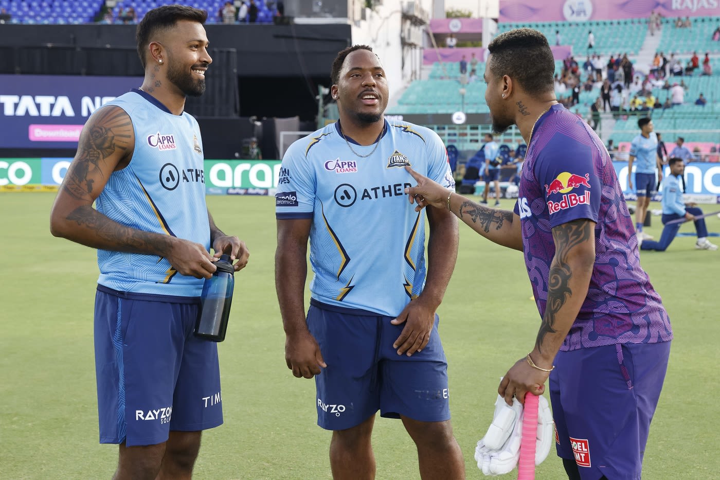 Hardik Pandya, Odean Smith and Shimron Hetmyer catch up before the game