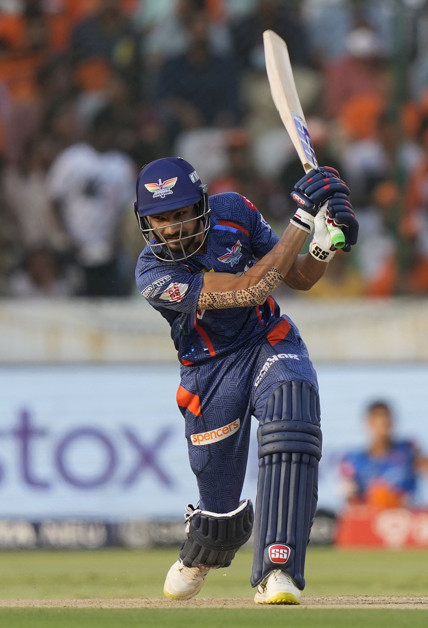 Prerak Mankad drives down the ground