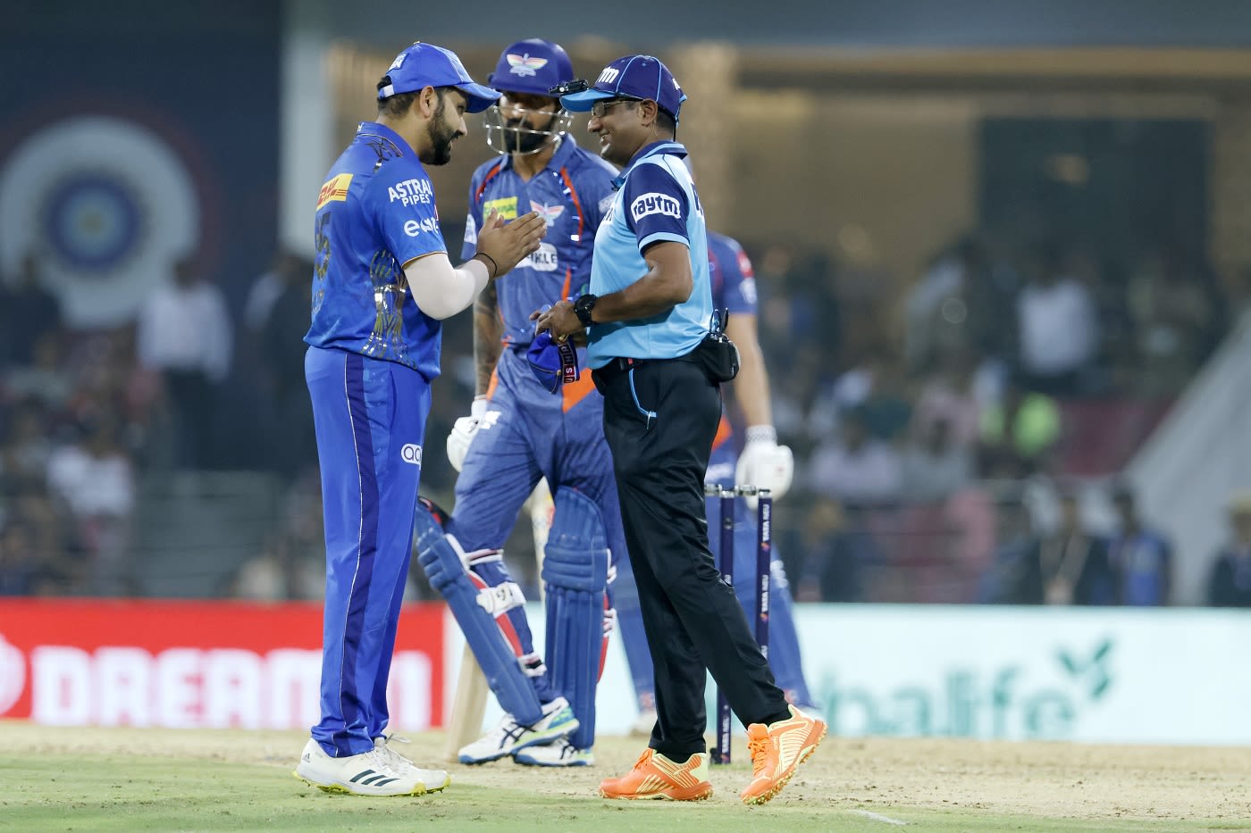 Rohit Sharma and umpire Nand Kishore discuss a wide call