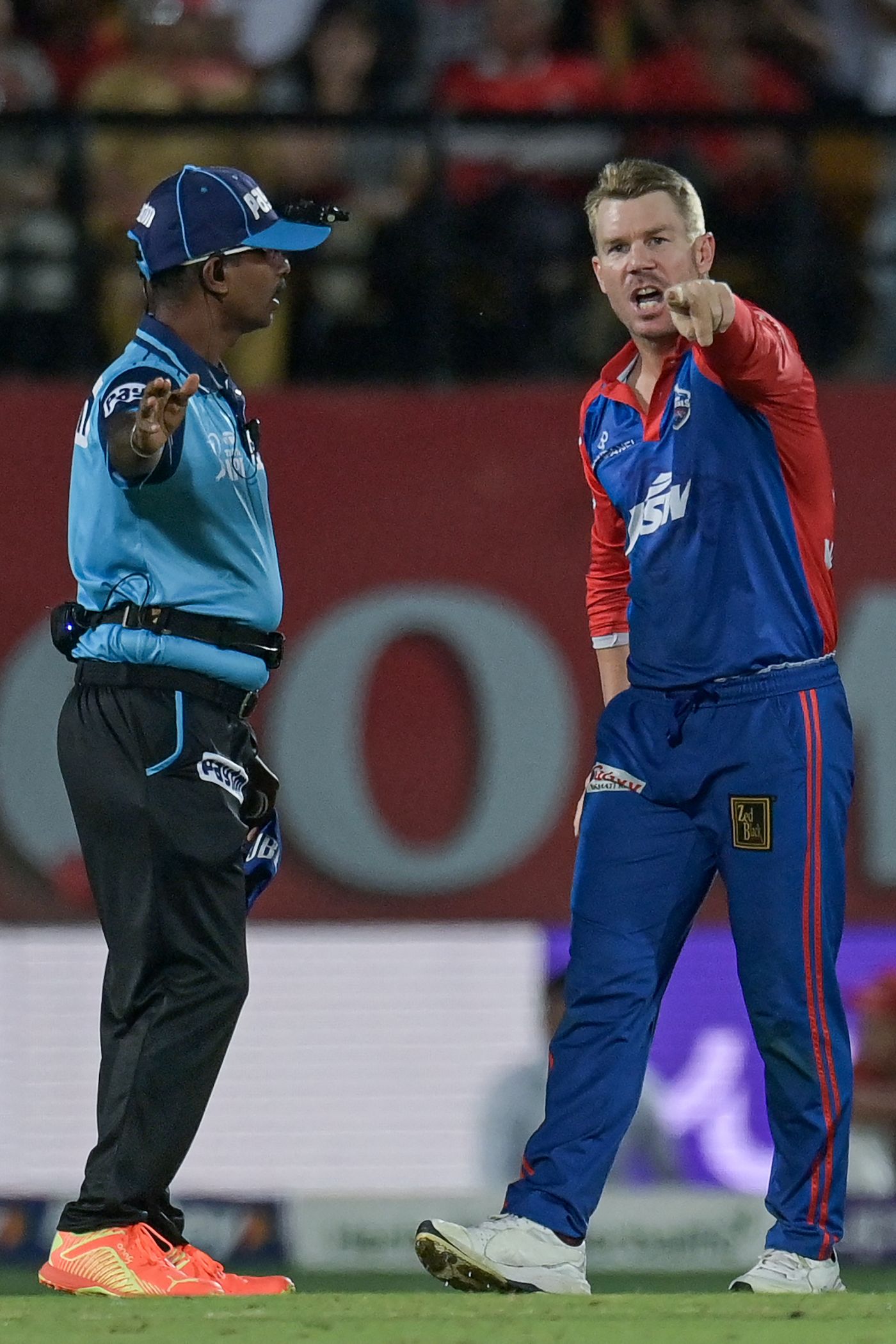 David Warner and Saidharshan Kumar, the on-field umpire, argue over a no-ball call