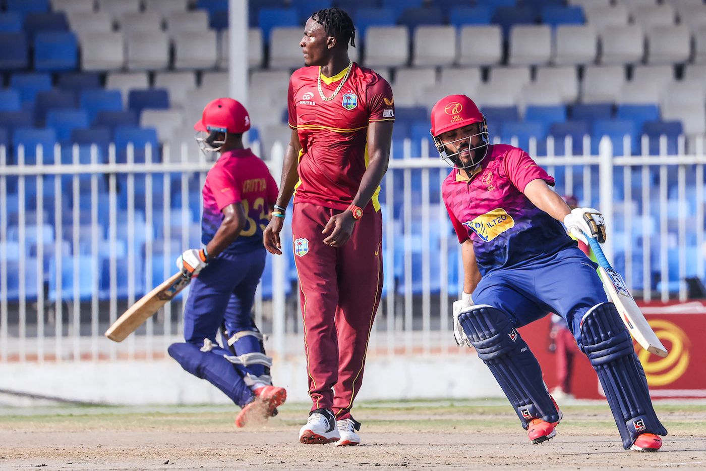 Vriitya Aravind and Rameez Shahzad take a run as Dominic Drakes looks on