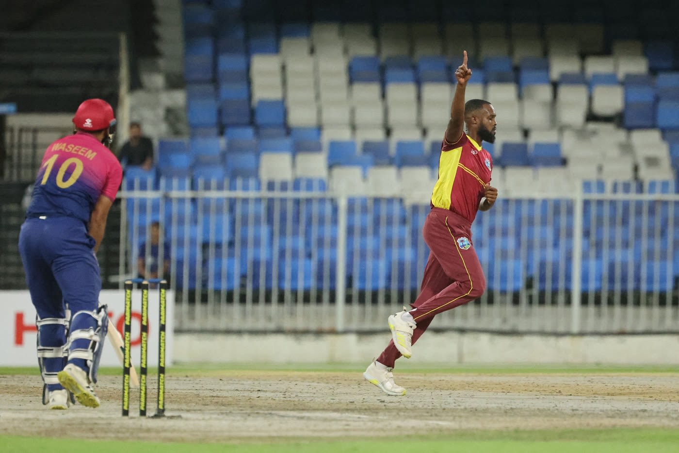 Akeem Jordan wheels away after dismissing Muhammad Waseem