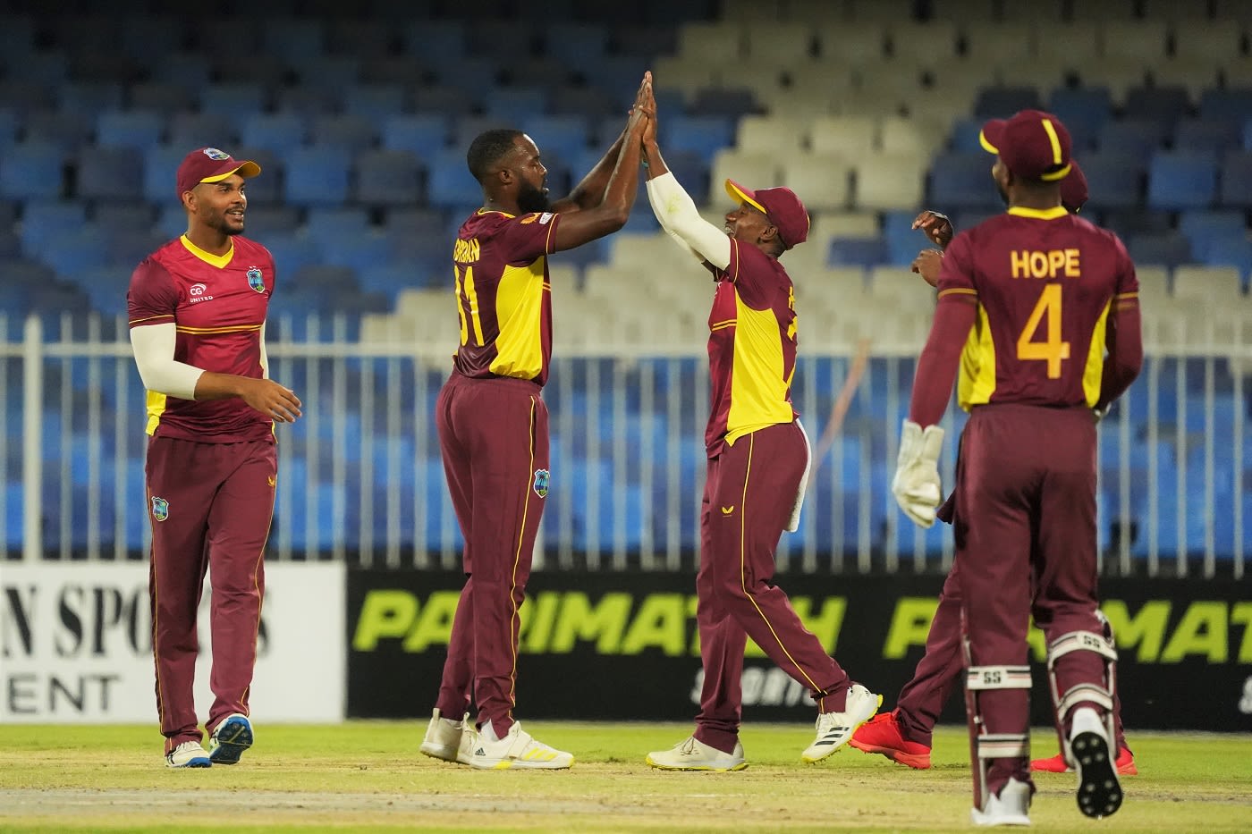 Akeem Jordan celebrates with team-mates on getting Muhammad Waseem
