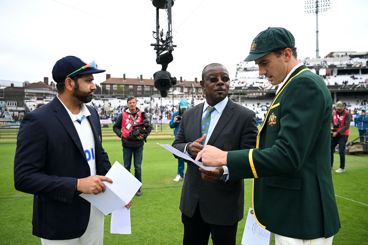 Rohit Sharma and Pat Cummins at the toss alongside Richie Richardson, the match referee