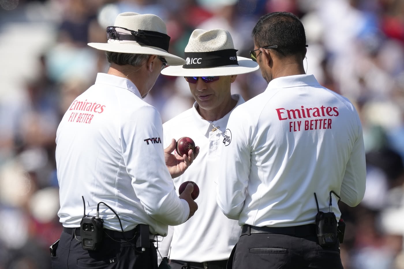 The umpires got together to inspect and change the ball