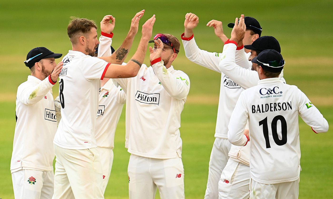 Tom Bailey is congratulated by his team-mates